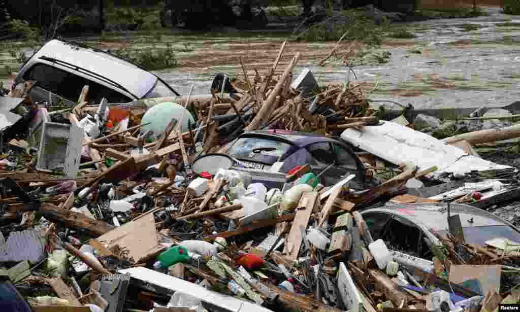 Cars and debris are seen in a flooded street in the town of Braunsbach, in Baden-Wuerttemberg, Germany.