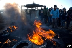 Settlers burn tires outside the Amona outpost in the West Bank, Feb. 1, 2017. The military issued eviction orders the day before, telling residents to evacuate Amona within 48 hours and blocked roads leading to the outpost.