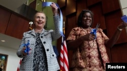 FILE - U.S. Secretary of State Hillary Clinton (L) attends a ribbon-cutting ceremony for the new U.S. Embassy with U.S. Ambassador to Liberia Linda Thomas-Greenfield (R) in Monrovia, Jan. 16, 2012.