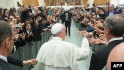 Image shows Pope Francis during a meeting with the community of the Pontifical Gregorian University, at Paul VI audience hall at the Vatican, April 10, 2014. 