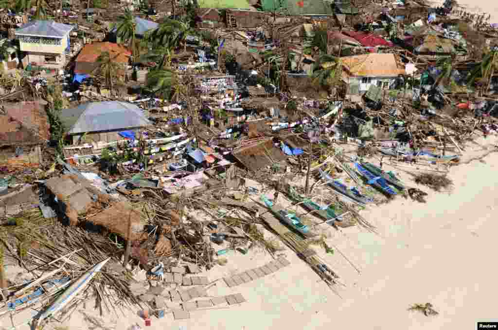 An aerial view shows damaged houses on a coastal community, after Typhoon Haiyan hit Iloilo Province, central Philippines, Nov. 9, 2013. 