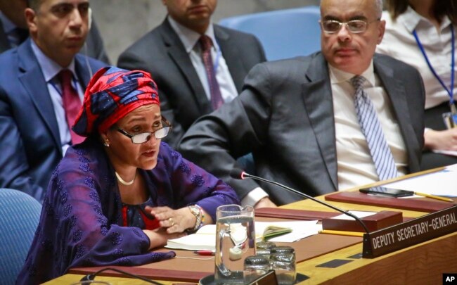 FILE - United Nations Deputy Secretary-General Amina Mohammed, left, addresses the Security Council meeting on peace and security in Africa, Aug. 10, 2017, at U.N. headquarters.