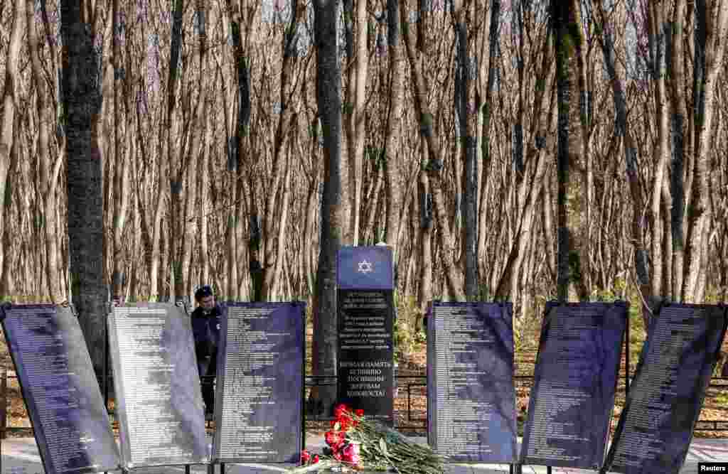 A police officer stands next to the monument commemorating the victims of the Nazi Holocaust killed in 1942, during its opening ceremony in Stavropol, Russia, Nov. 15, 2017.