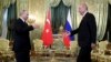 Russia's President Vladimir Putin, left, walks to shake hands with Turkey's President Recep Tayyip Erdogan, right, as he welcomes him prior to their meeting in Moscow, Russia, April 8, 2019.