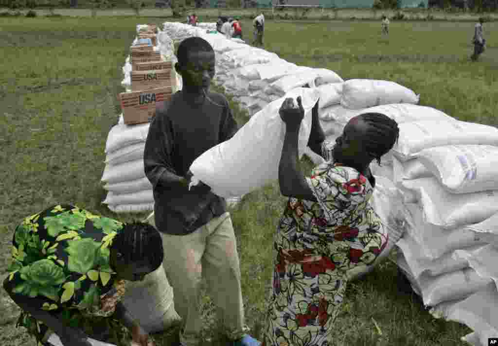CONGO: The World Food Program offered more than 60,000 Congolese refugees bags of maize meal near the town of Rutshuru, 70 kms north of Goma, eastern Congo, Friday, Nov. 14, 2008. AP photo.