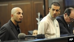 Ahmed Ferhani 26, left, and Mohamed Mamadouh 20, appear in court with their attorneys for arraignment, at Criminal Court in New York. Both men are charged with a terrorist plot targeting New York synagogues, May 12, 2011
