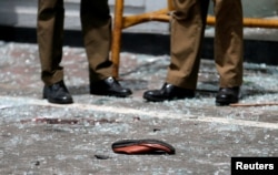 A shoe of a victim is seen in front of the St. Anthony's Shrine, Kochchikade church after an explosion in Colombo, Sri Lanka, April 21, 2019.