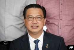 In this photo taken on March 3, 2016, Malaysian Transport Minister Liow Tong Lai poses for photographs prior to a press conference in Kuala Lumpur, Malaysia. Liow says two plane pieces found in Mozambique will be sent to Australia to verify if they belong