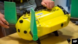 Taavi Salumae, designer of the U-CAT robot and researcher at the Biorobotics Centre at the Tallinn University of Technology, prepares the U-CAT robot for testing in an aquarium in Tallinn, Estonia. This underwater turtle robot is breaking ground in maritime archeology by using fins instead of propellers. 