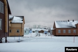 Snow is seen on the Ny-Alesund research center, that was formerly a coal mining town, Oct. 19, 2015.