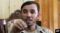 FILE - In this Aug. 4, 2016, photo, Gen. Abdul Raziq, Kandahar police chief, speaks during an interview with The Associated Press in Kandahar, Afghanistan. 