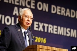 FILE - Malaysian Prime Minister Najib Razak speaks at a conference in Kuala Lumpur, Malaysia.