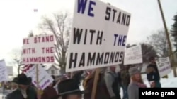 FILE - In a video grab, members of a militia group in the northwestern U.S. state of Oregon are seen rallying in support of two ranchers they say have received an unjust court sentence. 