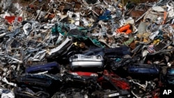 FILE - Ferrous metal heaped in a scrapyard at the harbor in Dortmund Port, Germany.