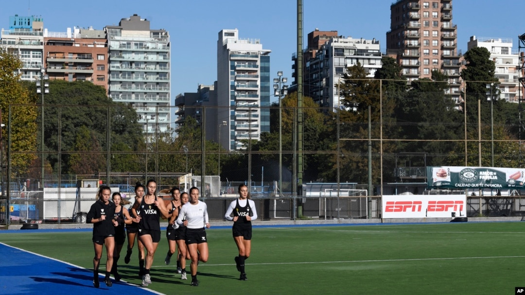 Las Leonas Argentina women's national field hockey team members run laps as they train for the Paris Olympic Games, in Buenos Aires, Argentina, Thursday, May 16, 2024.