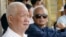 FILE - Former Khmer Rouge leaders Khieu Samphan, left, and Nuon Chea sit together during funeral services for Khieu Ponnary, the first wife of Khmer Rouge leader Pol Pot, in the former Khmer Rouge stronghold of Pailin, northwestern Cambodia, July 3, 2003.