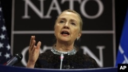 U.S. Secretary of State Hillary Clinton speaks at a press conference at NATO headquarters in Brussels, Belgium, December 5, 2012.