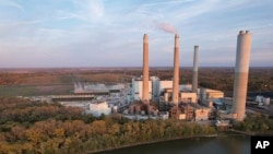 Steam rises from the AES Indiana Petersburg Generating Station, Oct. 25, 2023. Sometime in early 2029, the world will likely be unable to stay below the temperature limit for global warming if it continues to burn fossil fuels at its current rate, a new study says.