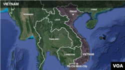 A Palestinian man rides his donkey cart past a building that was destroyed during the 11-day war in May of this year between Israel and the Palestinian Hamas movement, in Gaza City.