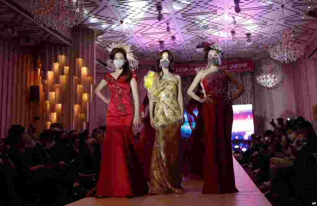 Models wearing face masks pose during a fashion show in Seoul, South Korea.