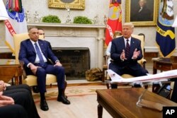 FILE - President Donald Trump meets with Iraqi Prime Minister Mustafa Kadhimi in the Oval Office of the White House, Aug. 20, 2020.