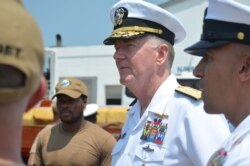 U.S. Navy Admiral James Foggo, in Ghana to participate in a conference on international maritime defense, meets with Navy personnel. (Stacey Knott for VOA)