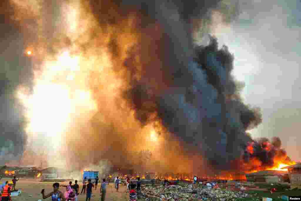Smoke billows at the site of the Rohingya refugee camp where fire broke out in Cox&#39;s Bazar, Bangladesh, March 22, 2021.