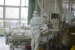 A picture released by the Central Hospital of Wuhan shows medical staff attending to patient at the The Central Hospital Of Wuhan Via Weibo in Wuhan, China on an unknown date.