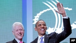 President Barack Obama and former President Bill Clinton shake hands at the Clinton Global Initiative in New York, Sept., 21, 2011