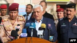 FILE - Falih al-Fayyadh, Iraqi's then-national security adviser, gives a press conference in the southern city of Basra, March 7, 2018.