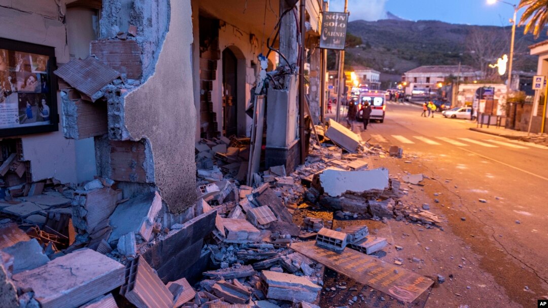 Debris of a partially collapsed house sit on the street in Fleri, Sicily, Dec. 26, 2018. 