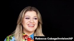 FILE - Singer and actress Kelly Clarkson poses for a portrait at the Four Seasons Hotel in Los Angeles, April 14, 2019. 