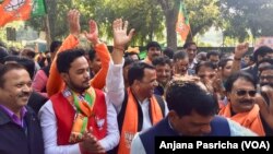 BJP party supporters danced and celebrated as results for the elections came in, Dec. 18, 2017.
