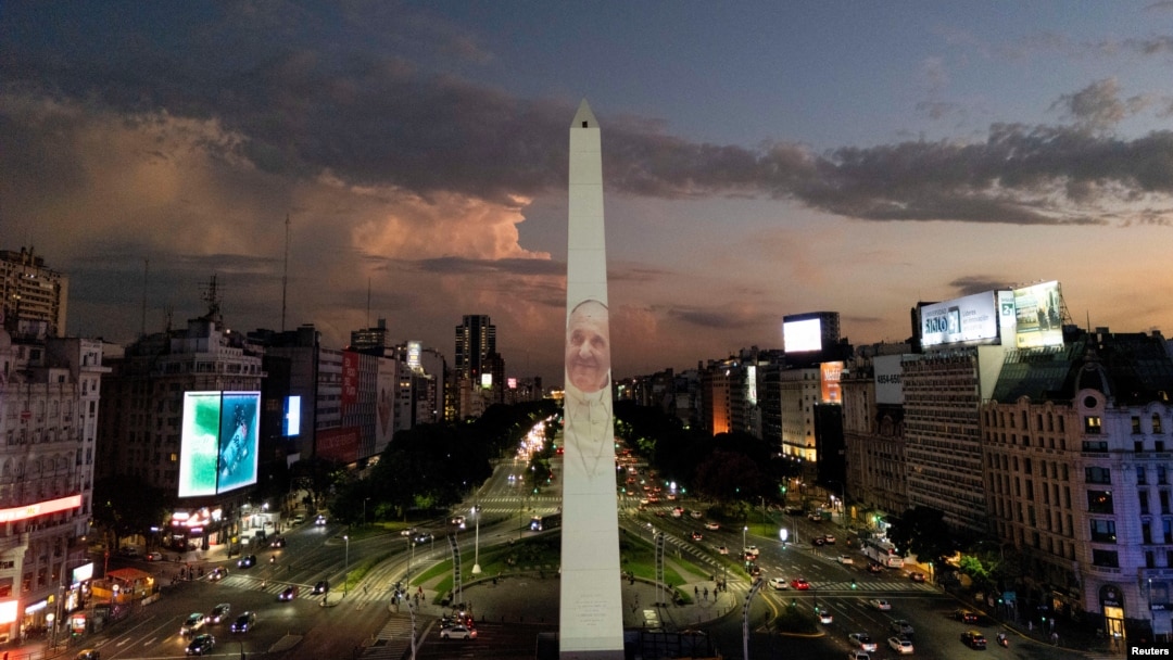 A drone view shows an image of Pope Francis displayed with a digital video-mapping at the Obelisco as the worlds pray for the pontiff’s health, in Buenos Aires, Argentina, Feb. 21, 2025.
