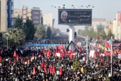 Iranian people attend a funeral procession for Major-General Qassem Soleimani, in his hometown in Kerman, Jan. 7, 2020. (Mehdi Bolourian/Fars News Agency/WANA via Reuters)