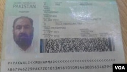 FILE - A photo shows the Pakistani passport and ID card that Mullah Akhtar Mansoor was allegedly carrying. Mansoor was killed in a U.S. drone strike Saturday near the Pakistan-Afghanistan border.