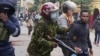 FILE - Kenyan anti-riot police arrest a man during a protest in Nairobi on June 27, 2024.