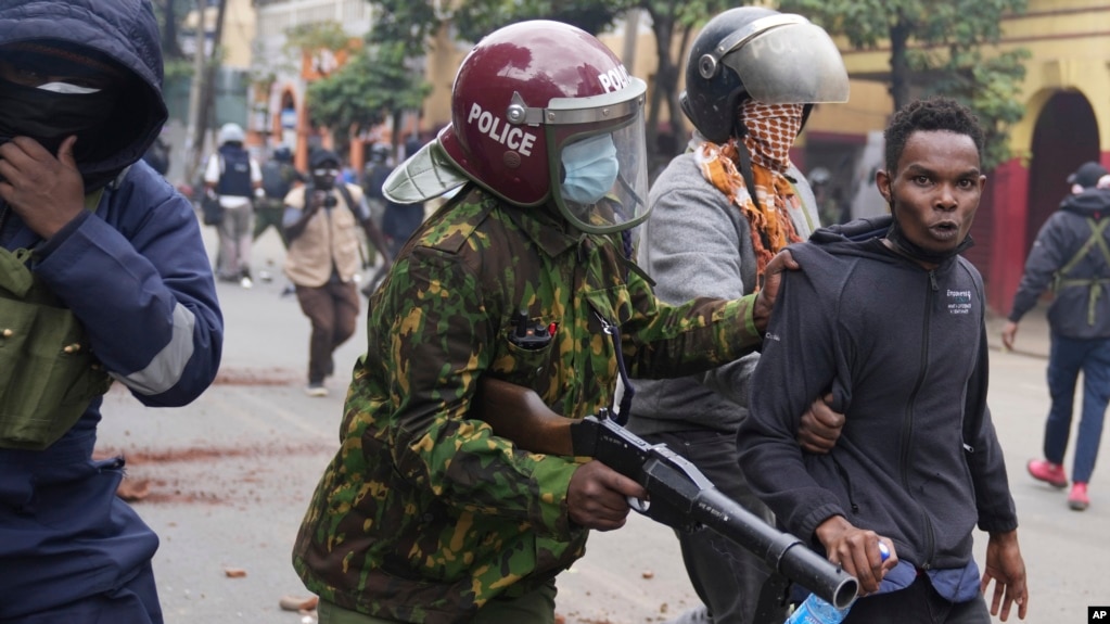 FILE - Kenyan anti-riot police arrest a man during a protest in Nairobi on June 27, 2024.