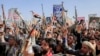 FILE - Houthi supporters raise weapons as they shout slogans during an anti-U.S and anti-Israel rally in Sanaa, Yemen, on Feb. 14, 2025. The U.S. State Department on March 4, 2025, designated the Iran-backed group as a "foreign terrorist organization."