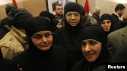 Nuns, who were freed after being held by rebels for over three months, arrive at the Syrian border with Lebanon at the Jdaydeh Yaboos crossing, March 10, 2014.
