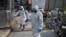 Health emergency crew disinfect an area in Wuhan, China during the coronavirus outbreak