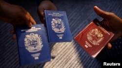 FILE - Venezuelan passports are shown Oct. 16, 2022, in Ciudad Juarez, Mexico.