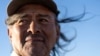 Navajo Richard Begay poses for a portrait while taking a break from herding his goats, on the Navajo Nation in Dilkon, Ariz., Oct. 17, 2024. 