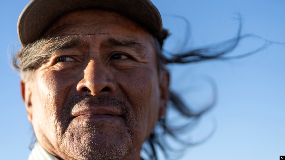 Navajo Richard Begay poses for a portrait while taking a break from herding his goats, on the Navajo Nation in Dilkon, Ariz., Oct. 17, 2024. 