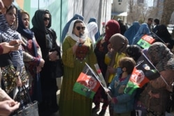 FILE - Afghan civil society activists are seen gathered during International Women's Day, in Kabul, Afghanistan, March 8, 2020.