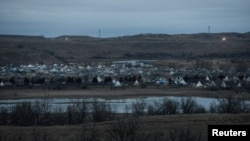 FILE - The protest encampment is seen during a protest against plans to pass the Dakota Access pipeline near the Standing Rock Indian Reservation, near Cannon Ball, N.D., Nov. 17, 2016. 