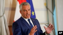 FILE - Austrian Chancellor Karl Nehammer attends a press conference in Vienna, Aug. 8, 2024. Nehammer said Saturday he will resign after talks on forming a new government failed a second time. 