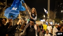 People celebrate after the Israeli military confirmed the death of Hamas leader Yahya Sinwar, in Jerusalem on Oct. 17, 2024.