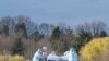 Medical workers push a patient to a waiting medical helicopter at the Emile Muller hospital in Mulhouse, eastern France, during the coronavirus pandemic.