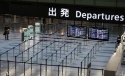 An empty departures are is pictured at Haneda Airport in Tokyo, Japan, March 4, 2020.